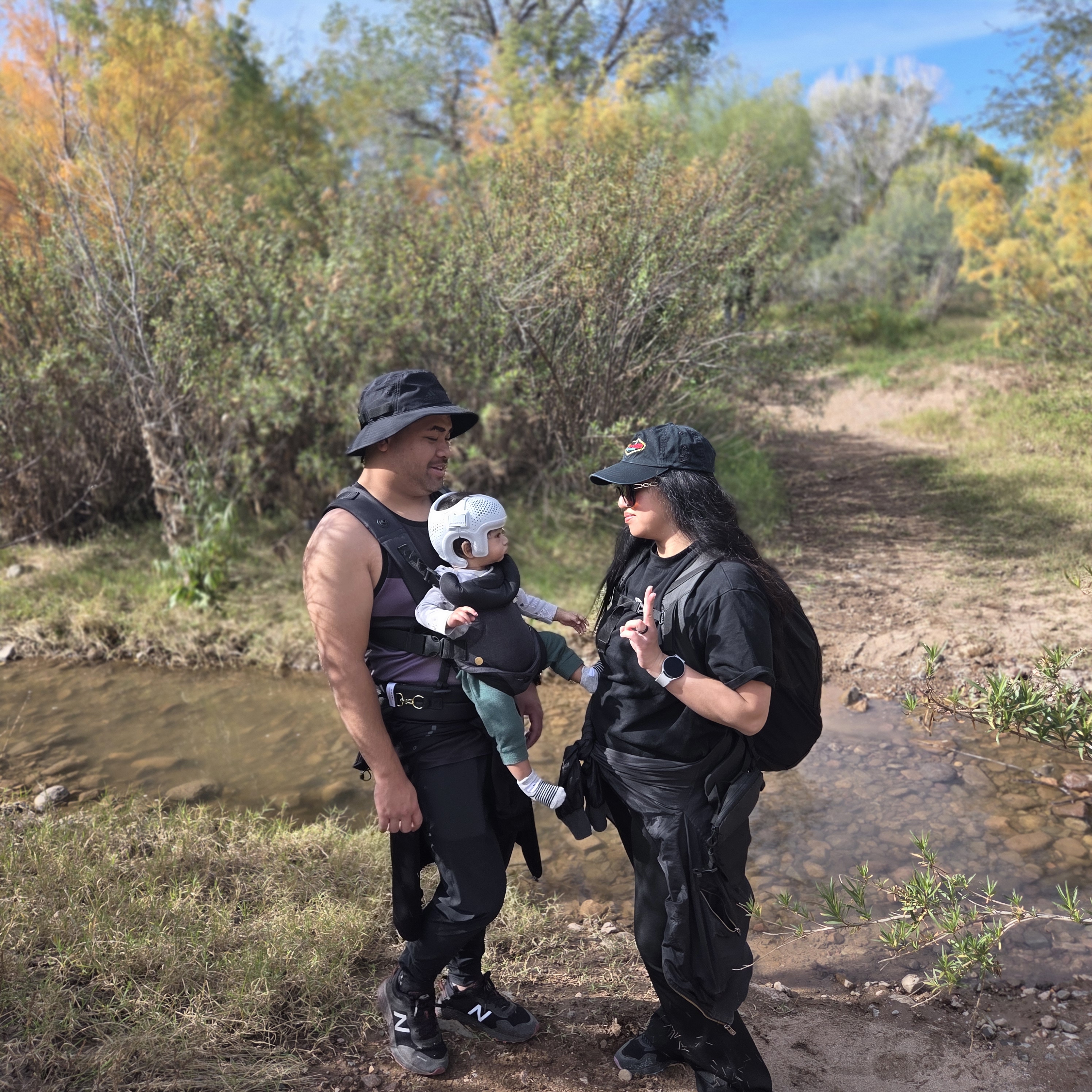 family of three not looking at camera on a hike