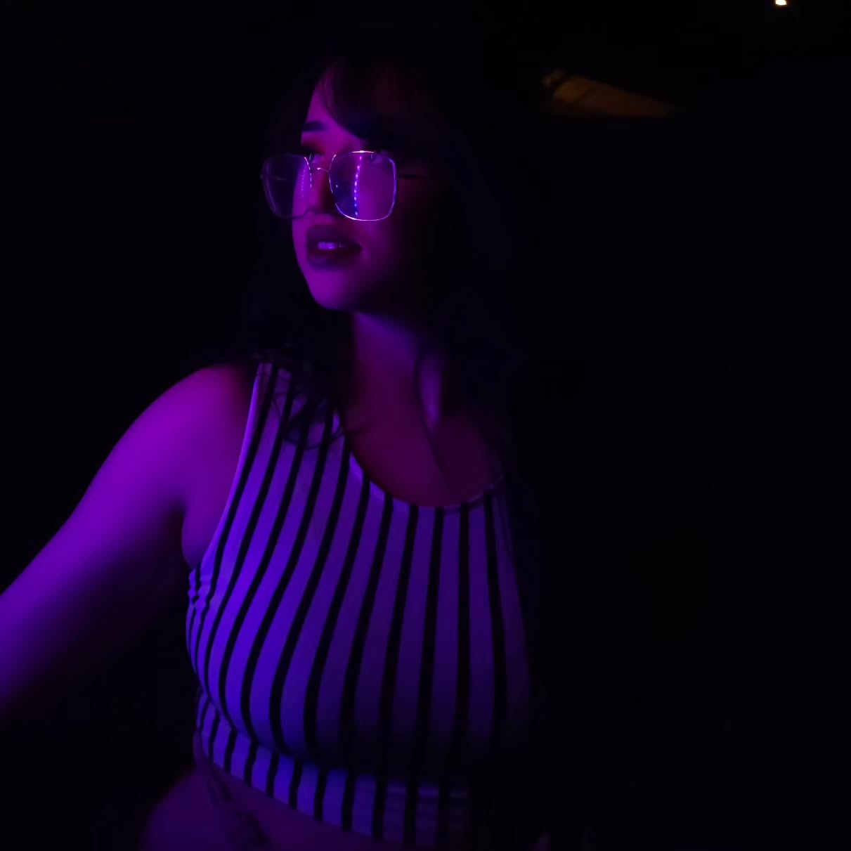 a girl looking up with purple hue